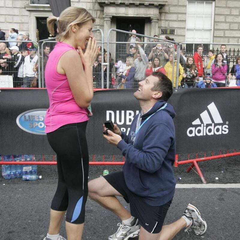 Will Fry proposing to his girlfriend, Rachel Stamford, after they both finished the 2009 marathon. Photograph: Dara Mac Dónaill