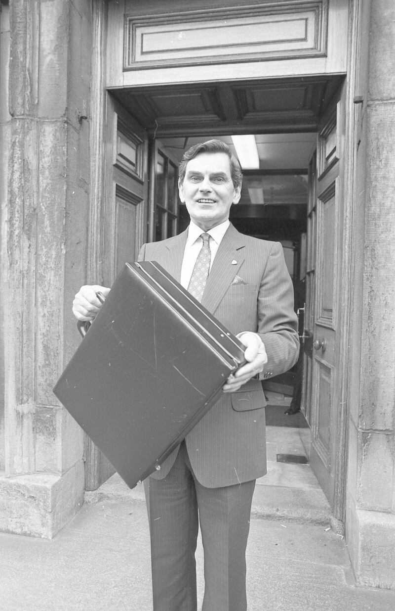 1987: Ray MacSharry holds aloft the budget bag. Photograph: Getty Images