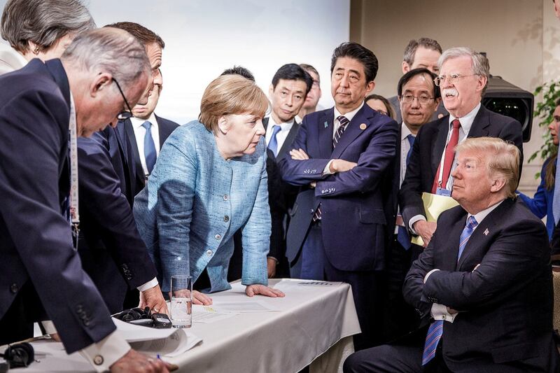 The room where it happened: John Bolton with Donald Trump, Angela Merkel and other G7 leaders in 2018. Photograph: Jesco Denzel/Bundesregierung/HO via Reuters
