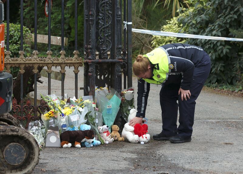 Floral tributes and soft toys left at the entrance to the site where gardaí searching for missing boy Daniel Aruebose on Wednesday found human remains. Photograph: Colin Keegan/Collins
