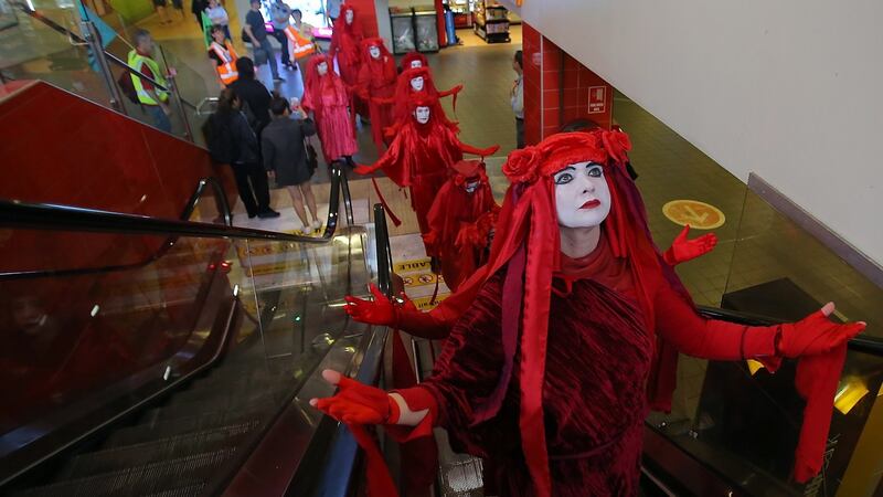 Red Rebels from Extinction Rebellion participate in a protest at Central Station in Sydney. Photo:  EPA/Steven Saphore
