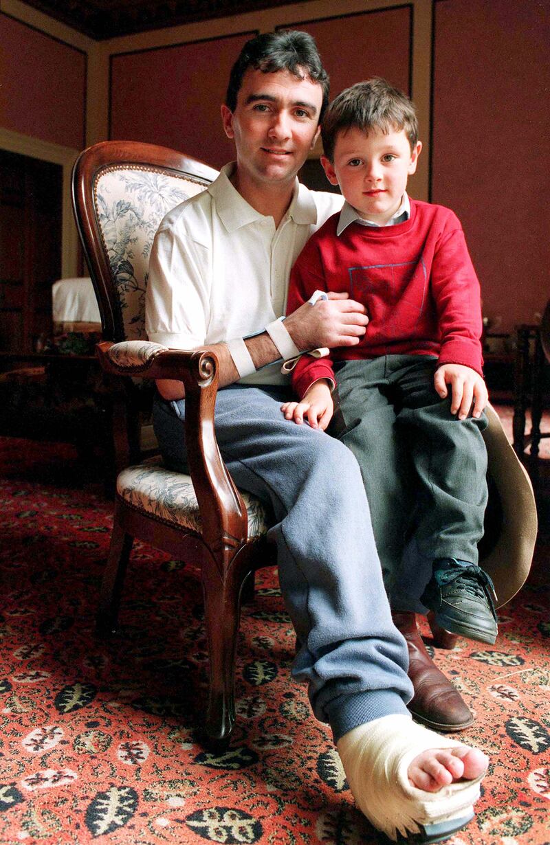 Robert Dunlop photographed with his son Michael in 1994 as he recovered from his Isle of Man TT crash injuries. Michael has gone on to become one of the world’s leading road racers.  Photograph: Stephen Davison