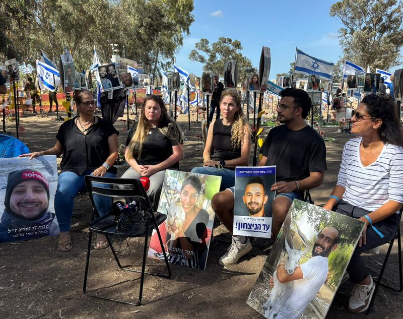 (Left to right) Moran,  sister of Ben Cohen; Shalev, brother of Eden Moshe; Adva, sister of Tamar Gutman; Gal sister of Dor Toar; and Rona, cousin of Dor, speak to reporters about their relatives, who were killed in the Hamas-led attack on the Nova music festival in Israel on October 7th. Photograph courtesy of the victims' families.