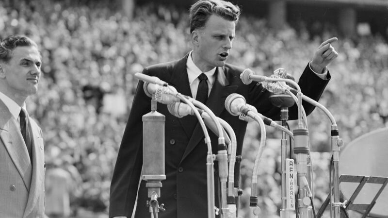 Billy Graham preaches to over 100,000 Berliners at the Olympic Stadium in Berlin, Germany, in June 1954. He died at his home in North Carolina on Wednesday aged 99. File photograph: AP