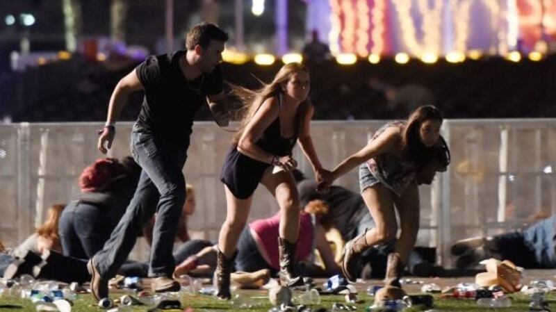 People run from the Route 91 Harvest country music festival after a shooting in Las Vegas, Nevada. Photograph: David Becker/Getty Images