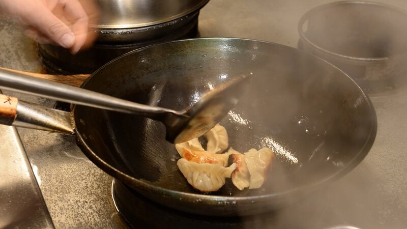 Kwanghi Chan making pot sticker dumplings. Photograph: Dara Mac Dónaill