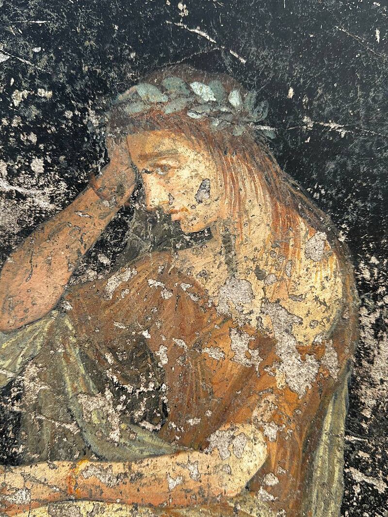 An image of Cassandra, discovered by archaeologists excavating Pompeii who uncovered a dining room with its walls painted black and decorated with people associated with the Trojan War. Photograph: Parco Archeologico di Pompei via The New York Times