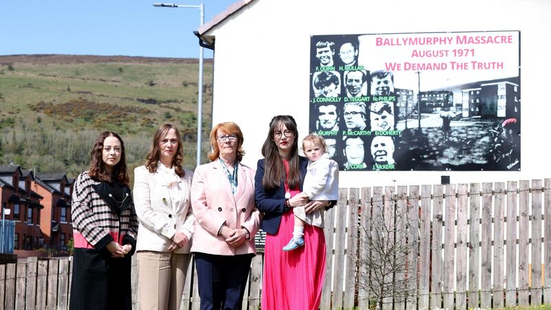 At a mural on Whiterock road, Belfast depicting the Ballymurphy massacre where John Laverty was killed: Mary Kate Quinn (right) who is pictured with her daughter, Blaithín, her mother, Carmel, sister Mairead and aunt, Rita Bonner. Photograph: Stephen Davison