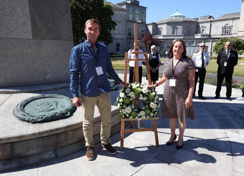 Brefni Grey and Emer Nowlan, the great-grandson and great-grand daughter of Arthur Griffith pictured after laying a wreath at a remembrance event at Leinster House to mark the centenary of his death. Photograph: Robbie Reynolds