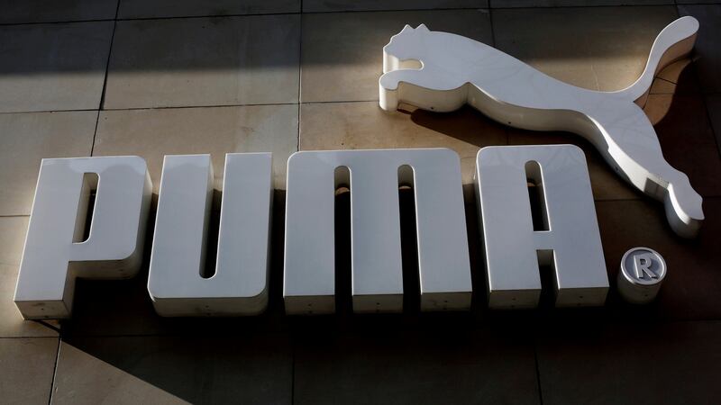 The logo of German sports goods firm Puma is seen at the entrance of one of its stores in Vienna, Austria. Photograph: Leonhard Foeger / Reuters
