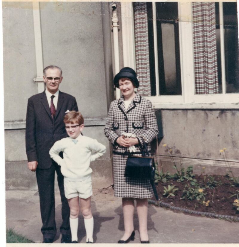 Patrick FitzSymons with his parents on his First Holy Communion