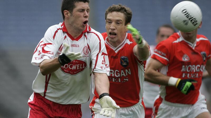 A young Sean Cavanagh in action against Armagh’s Kieran McGeeney during the Ulster final replay of 2005. Photographer: Dara Mac Dónaill