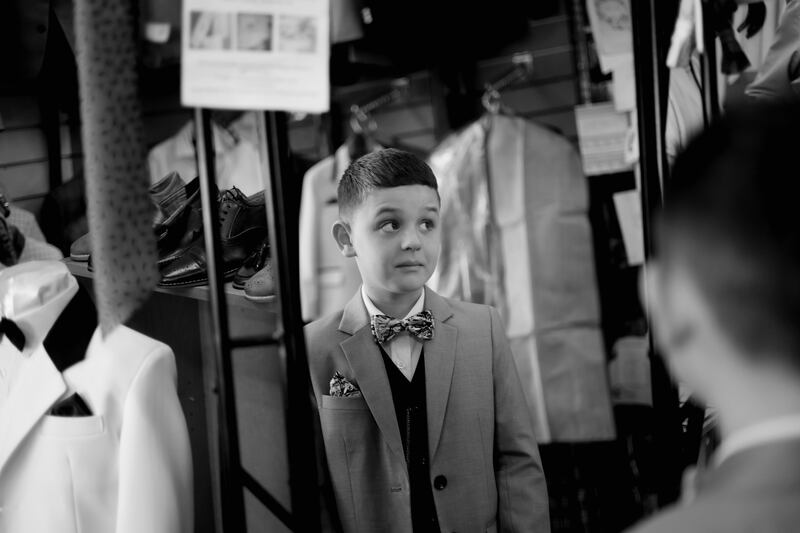 Bradley Cooney-Roche (8) tries out his new Holy Communion suit at Jas Fagan's Communion Shop on Thomas Street, Dublin. Photograph: Bryan O’Brien