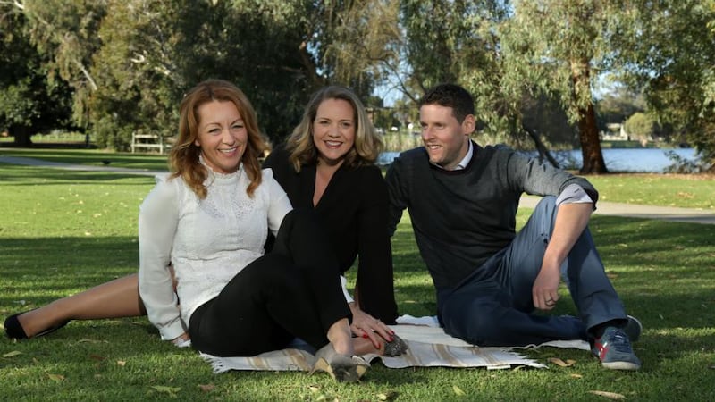 Vicki Buckley (left) with Irish husband and wife solicitor colleagues Leo Barry and Lindsay Ahern,  at Jackadder Lake in suburb of Woodlands in Perth. Photograph: Philip Gostelow