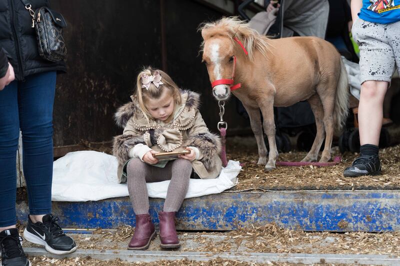 Three-year-old Berry Cross and her pony Annabella having some quiet time at the 300th annual Ballinasloe Horse Fair, Co Galway on Sunday. Photograph: Eamon Ward