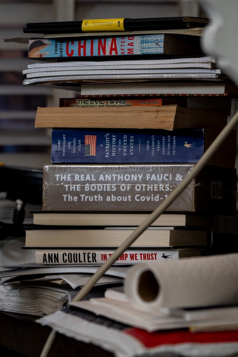 Steve Bannon’s basement is full of books on topics including China, Trump and weight loss programmes. Photograph: Erin Schaff/New York Times
                      