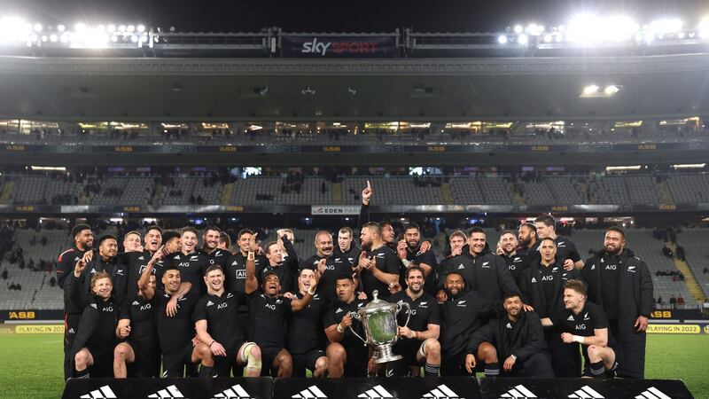 New Zealand players celebrate with the Bledisloe Cup after their victory over Australia at Eden Park. Photograph: Michael Bradley/AFP via Getty Images