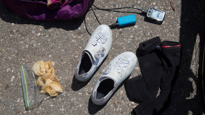 Crisps, shoes and a recharging GPS unit during Morgan Cabot’s break while completing the Everesting challenge on Mount Seymour. Photograph: Alec Jacobson/The New York Times