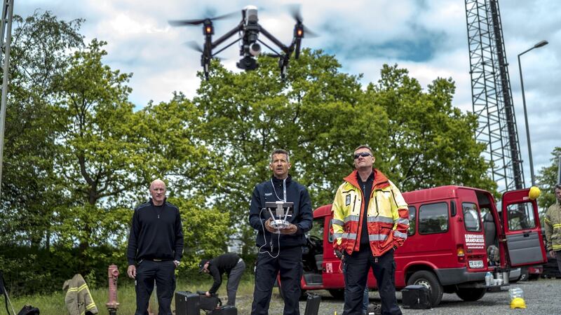Thomas Sylvest, right, Denmark’s first, and so far only, emergency service drone pilot, advises training participants at a fire and rescue training ground north of Copenhagen, May 18, 2016. Sylvest has responded to things as varied as missing person cases and fires. Teams from four countries are taking part in a trial to jump-start the use of unmanned aircraft by Europe’s emergency services. Photograph: Andrew Testa/The New York Times