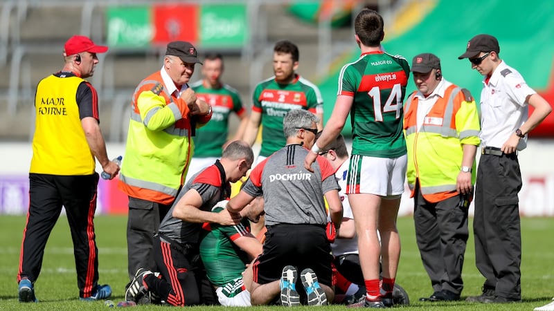 Mayo’s Séamus O’Shea receives medical attention. Photograph: Oisin Keniry/Inpho