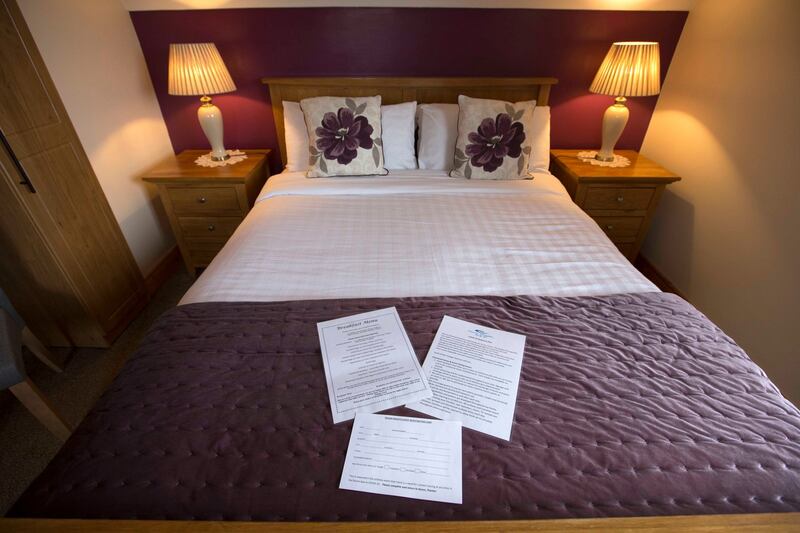 The breakfast menu, Covid-19 information sheet, and guest registration in a bedroom at Ocean Heights B&B. Photograph: Brian Farrell
