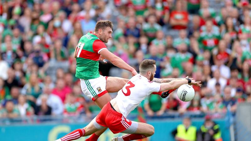 Aidan O’Shea has his goal effort blocked by Ronan McNamee. Photo: James Crombie/Inpho
