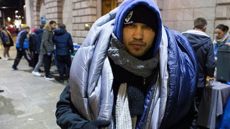 Dan Octivian (32), originally from Romania, with a sleeping bag over his shoulders, after receiving food provided by the Feed Our Homeless charity at College Green in Dublin. Photograph: Damien Eagers