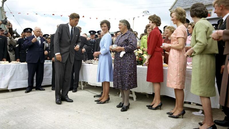 President Kennedy enjoys an outdoors tea party in his ancestral home with, from left, Josie Ryan, Mary Ryan, Kitty Kennedy, Mary Anne Ryan, Margaret Kirwan and Pat Kennedy