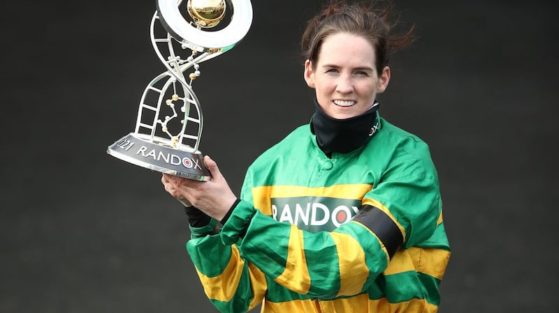 Rachael Blackmore celebrates with the trophy after winning the Grand National. Photograph:  Tim Goode/PA