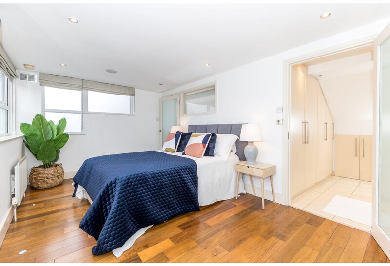 The converted attic is laid out as a bedroom currently 