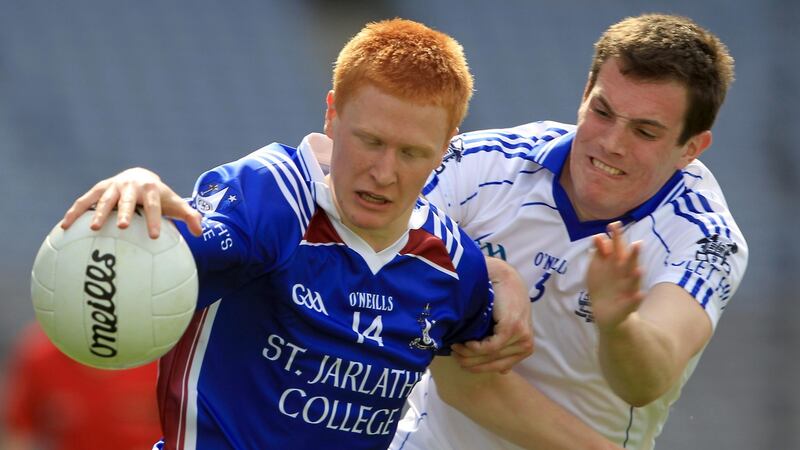 Adrian Varley of St Jarlath’s is challenged by  Niall Donnelly of St Colman’s, Newry during a Hogan Cup fixture in 2011. Photograph: Donall Farmer/Inpho