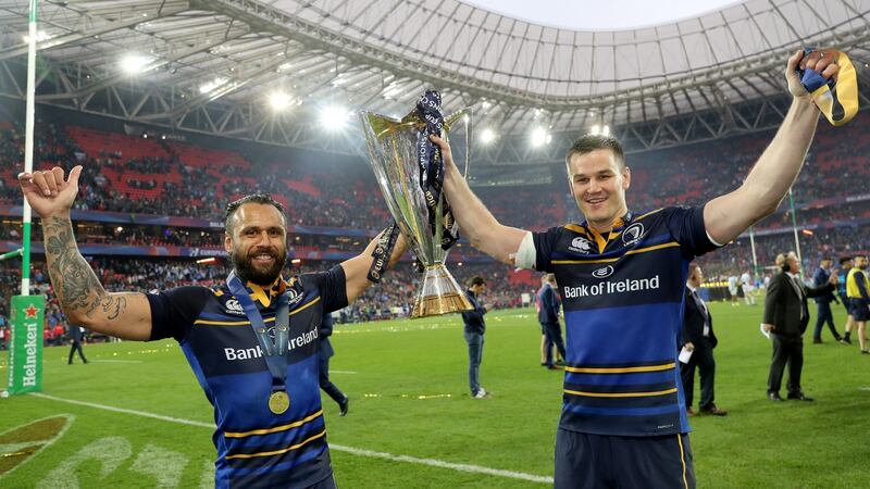 Isa Nacewa and Jonathan Sexton celebrate with the  Champions Cup trophy. Photograph: Dan Sheridan/Inpho