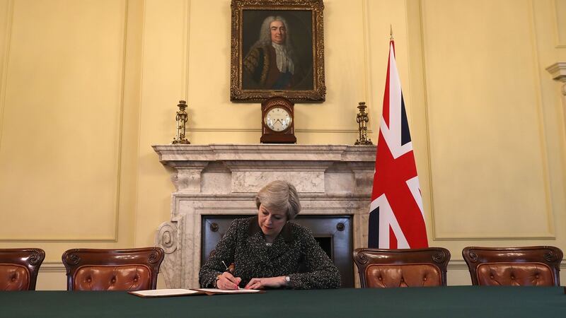 UK prime minister Theresa May  signs the Article 50 letter earlier this week.