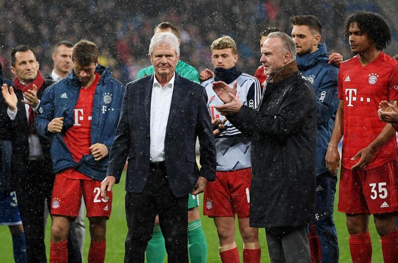 Karl-Heinz Rummenigge and Dietmar Hopp (centre) come together with players to applaud the home fans after demonstrations at the Bundesliga match between  Hoffenheim and FC Bayern Muenchen on Saturday in Sinsheim, Germany. Photograph: Matthias Hangst/Bongarts/Getty