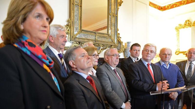 Tánaiste  and Minister for Foreign Affairs, Eamon Gilmore, surrounded by Labour ministers, speaking on his resignation as Labour Party leader, at Iveagh House, Dublin, this afternoon. Photograph: Eric Luke/The Irish Times