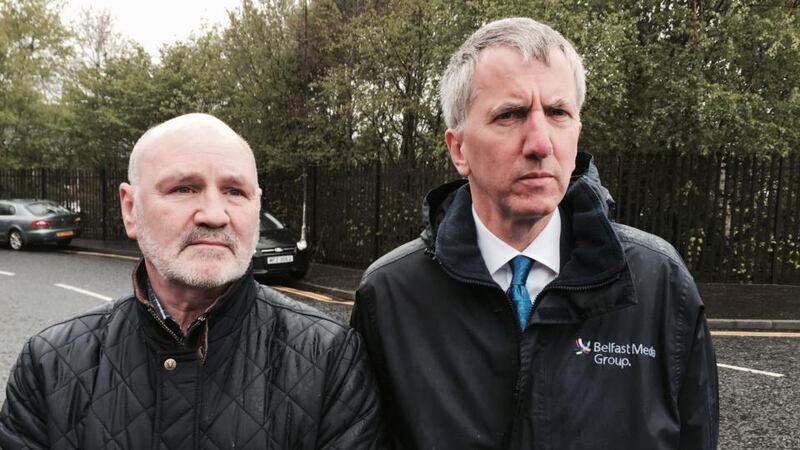 Sinn Féin MLAs Alex Maskey (left) and Máirtín Ó Muilleoir in the Markets area near Belfast city centre following the fatal shooting of Gerard ‘Jock’ Davison. Photograph: PA