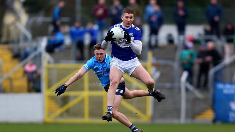 Laois’ Evan O’Carroll wins the ball ahead of Kieran Kennedy of Dublin during the O’Byrne Cup Final. Photograph: Ken Sutton/Inpho