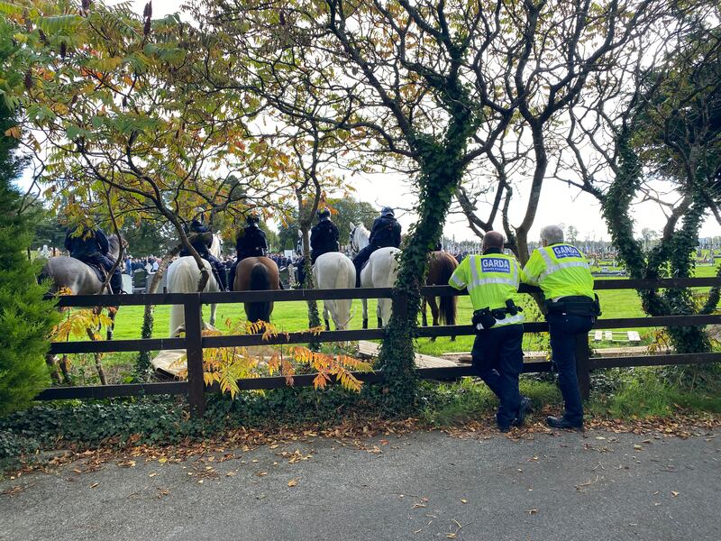 Gardaí a pictured near Clonminch Cemetery in Tullamore as the funeral of Tom Dooley took place in the town. Photograph: Alan Betson

