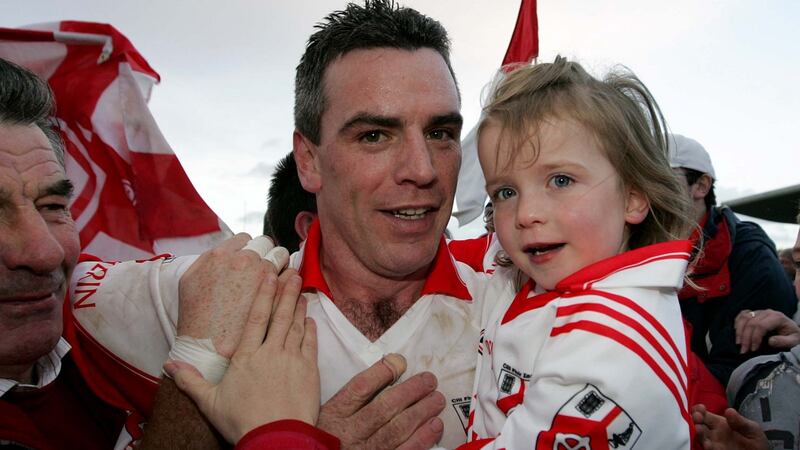 Pádraic Joyce with his daughter Ava at the 2007 Galway Club Football Final. Photograph: Lorraine O’Sullivan/Inpho