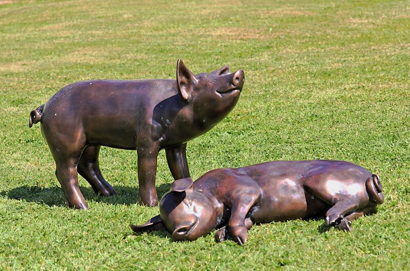 Two life-size bronze pigs (€600-€1,200) at Victor Mee's Summer Garden sale