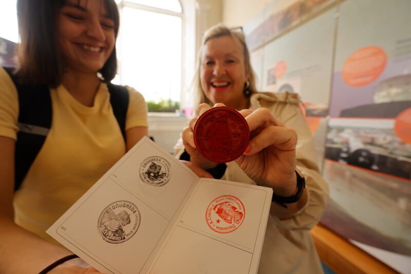 Kate Byrne receives a stamp from tourist adviser Deirdre Tyrrell at the start of the Boyne Valley Camino walk. Photograph: Alan Betson/The Irish Times

