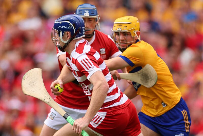 Cork’s Patrick Collins and  Mark Rodgers of Clare at close quarters during the All-Ireland final. Photograph: James Crombie/Inpho