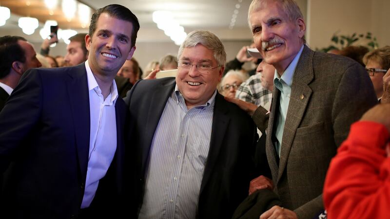 Donald Trump jnr greets West Virginia voters with Republican US Senate candidate Patrick Morrisey (centre) after speaking at a campaign event. Photograph: Win McNamee/Getty Images