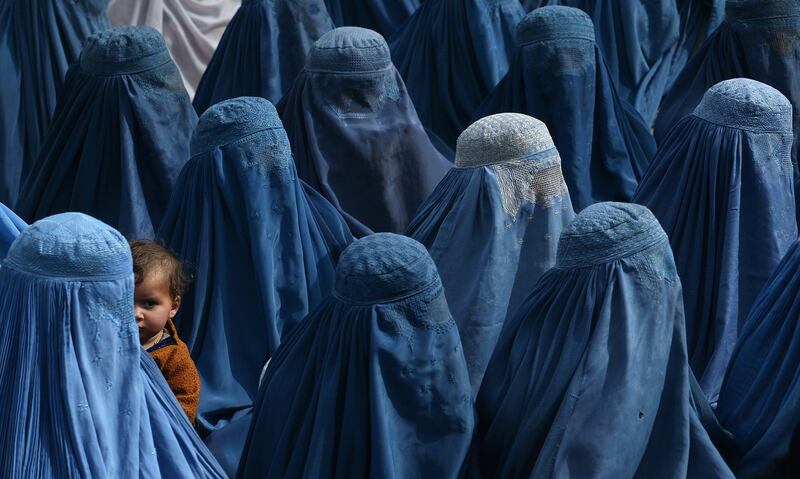 February 18th, 2014: An Afghan woman holds her baby as she and supporters attend the election rally of Afghan presidential candidate Abdullah Abdullah in Jalalabad. Photograph: Shah Marai/AFP