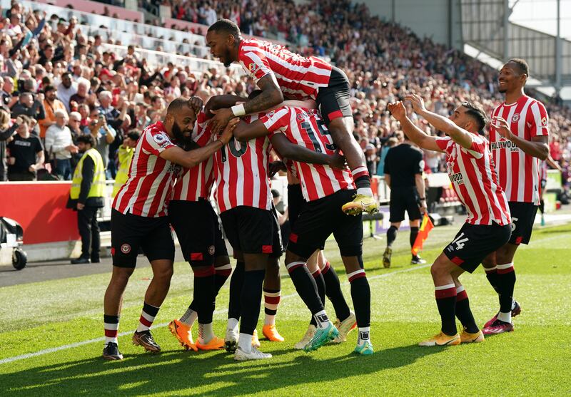 Brentford players celebrate after scoring in injury time against Nottingham Forest. Photograph: Nick Potts/PA