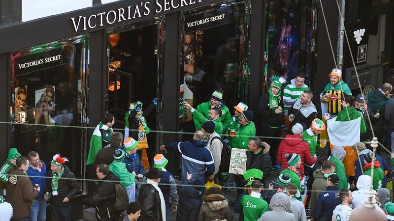 Model behaviour: Irish fans cheer people coming out of Victoria’s Secret in Copenhagen on Saturday.  What happens on the pitch seems far less interesting. Photograph: Stephen McCarthy/Sportsfile via Getty Images