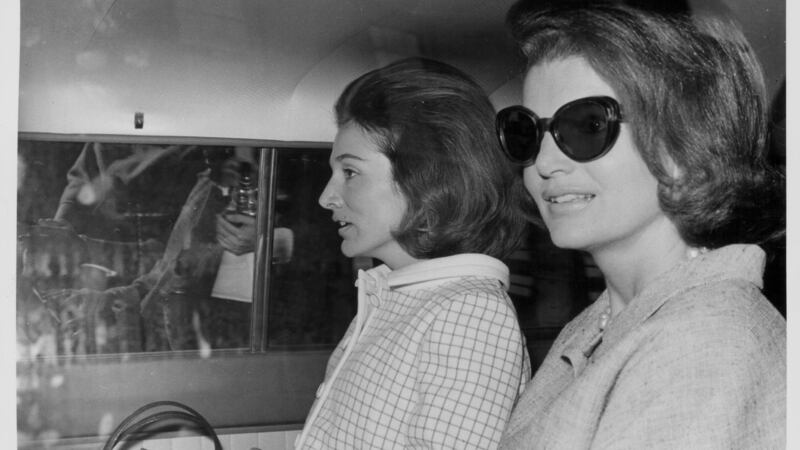 Sisters and socialites  Lee Radziwill and Jacqueline Kennedy, sitting in the back of a car in London, May 15th 1965. Photograph: Central Press/Getty Images