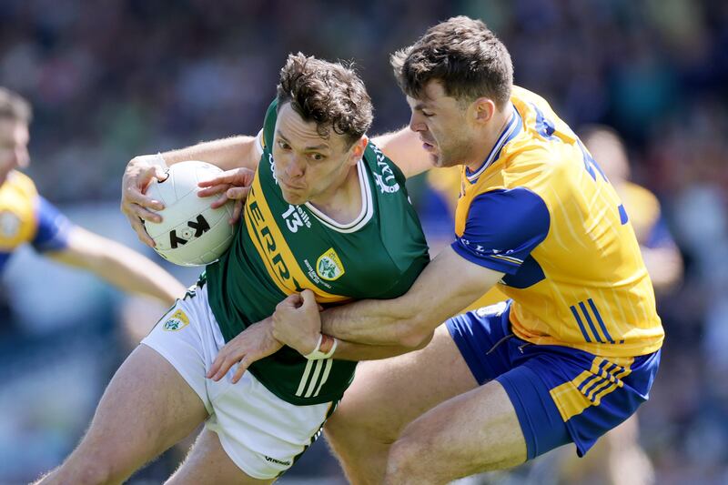 Kerry's David Clifford with Cillian Brennan of Clare. Photograph: Laszlo Geczo/Inpho