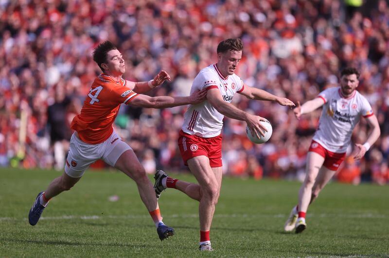 Tyrone's Brian Kennedy challenges Armagh's Ben Crealey during the Ulster SFC semi-final at St Tiernach's Park in Clones. Photograph: John McVitty/Inpho