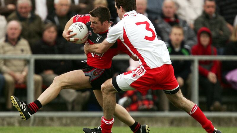 Tyrone’s Justin McMahon and Ronan Murtagh of Down during the quarter-final clash. Photograph:  INPHO/James Crombie
